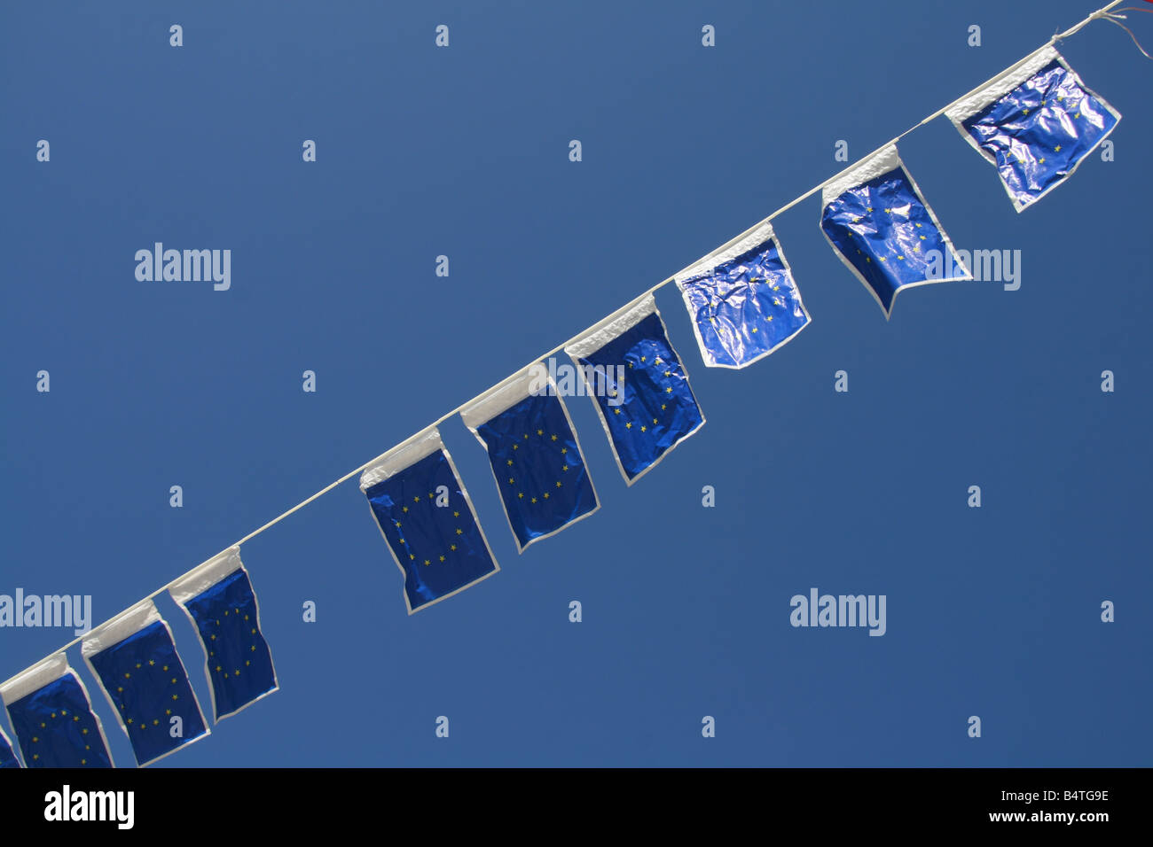 many european union flags flying in wind in sun Stock Photo - Alamy