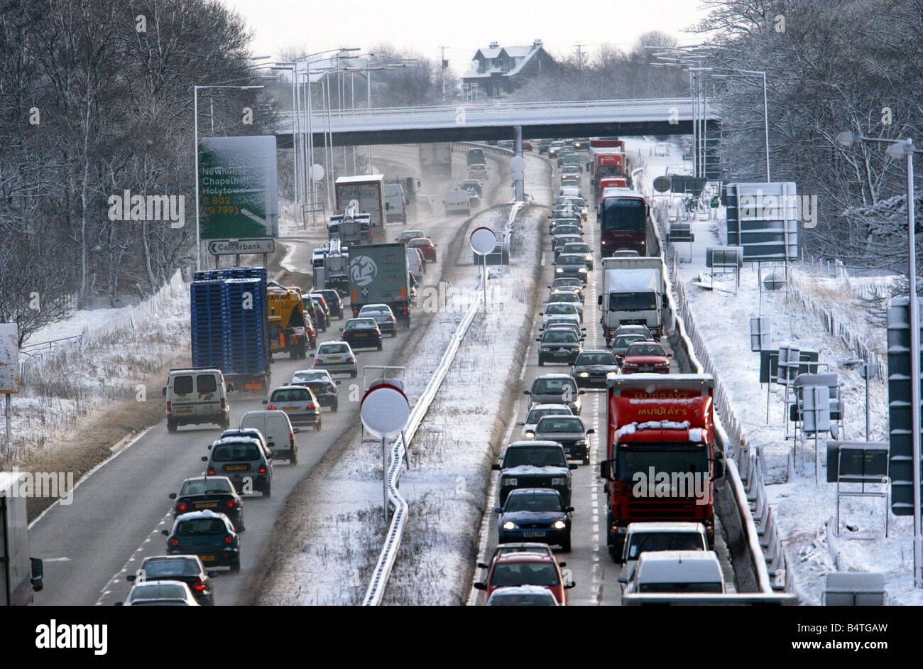 Morning traffic on the M8 motorway February 2003 after snowfall created misery for motorists an eight mile jam formed as commuters tried to get into the city Stock Photo