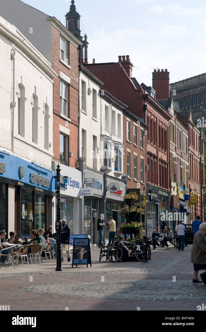 People shopping in Friargate pedestrianised street Preston city centre Lancashire UK Stock Photo