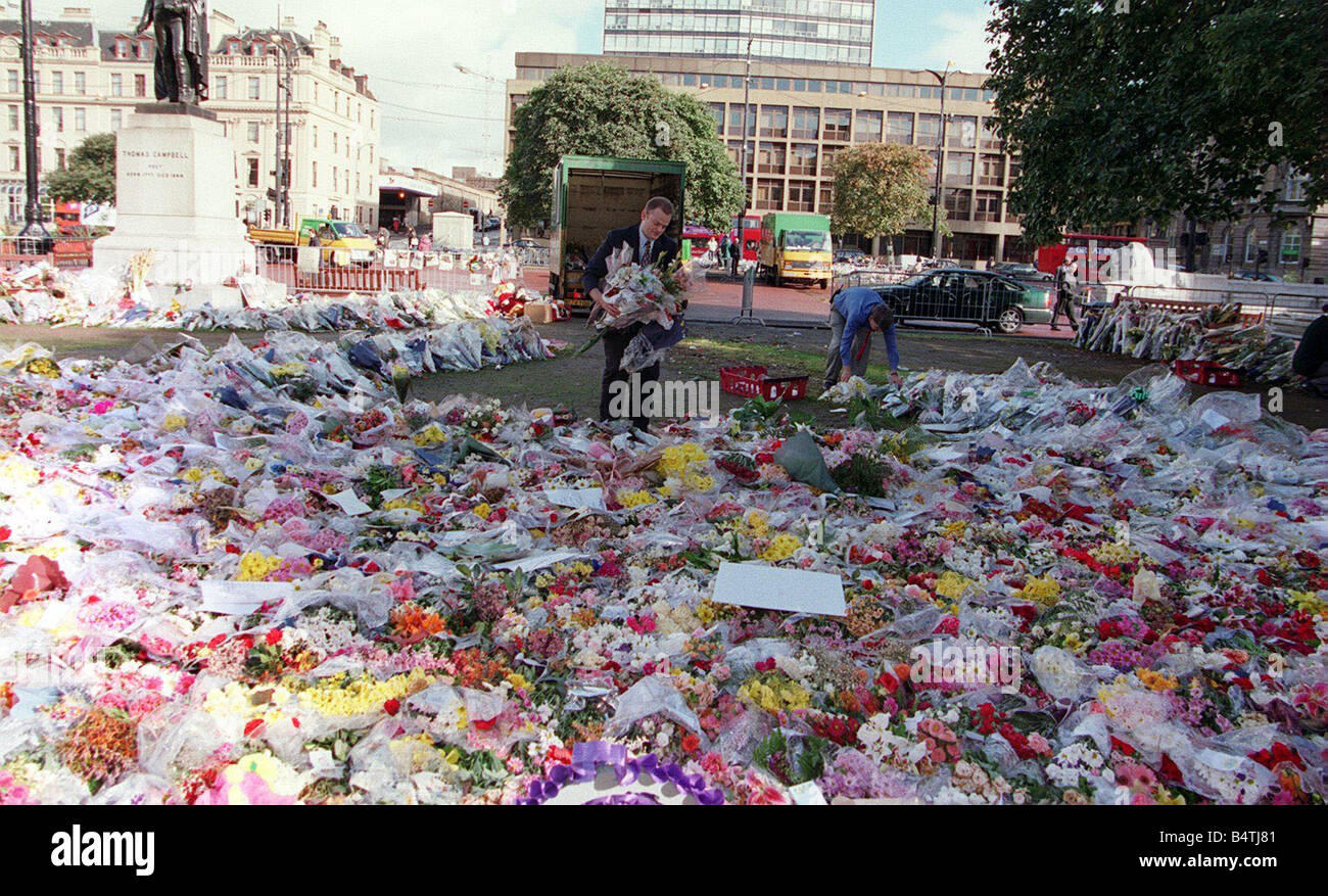Princess Diana Death 31 August 1997 Flowers being removed from George Square Glasgow Coucil workers men collecting bouquets of flowers Stock Photo