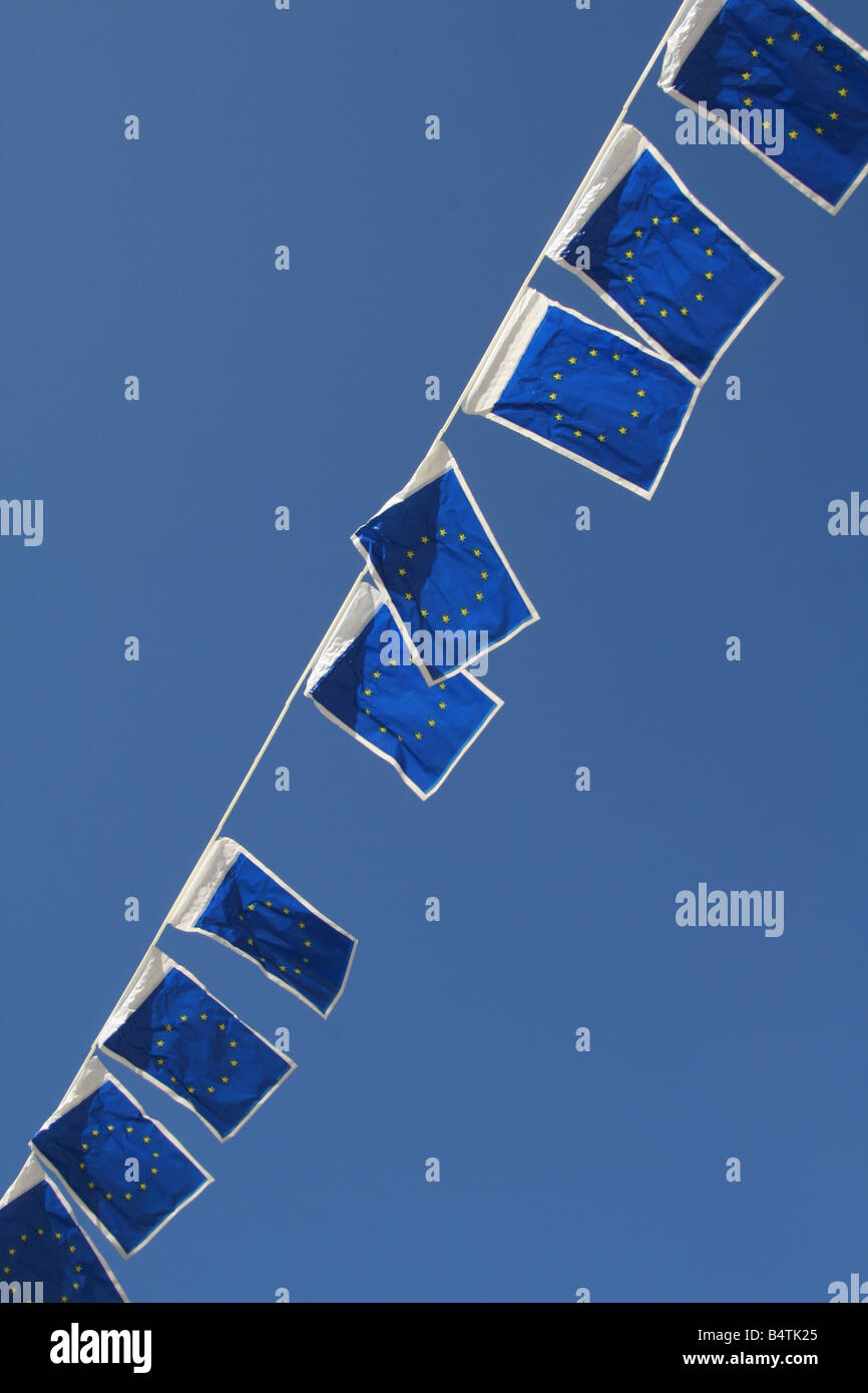 many european union flags flying in wind in sun Stock Photo - Alamy