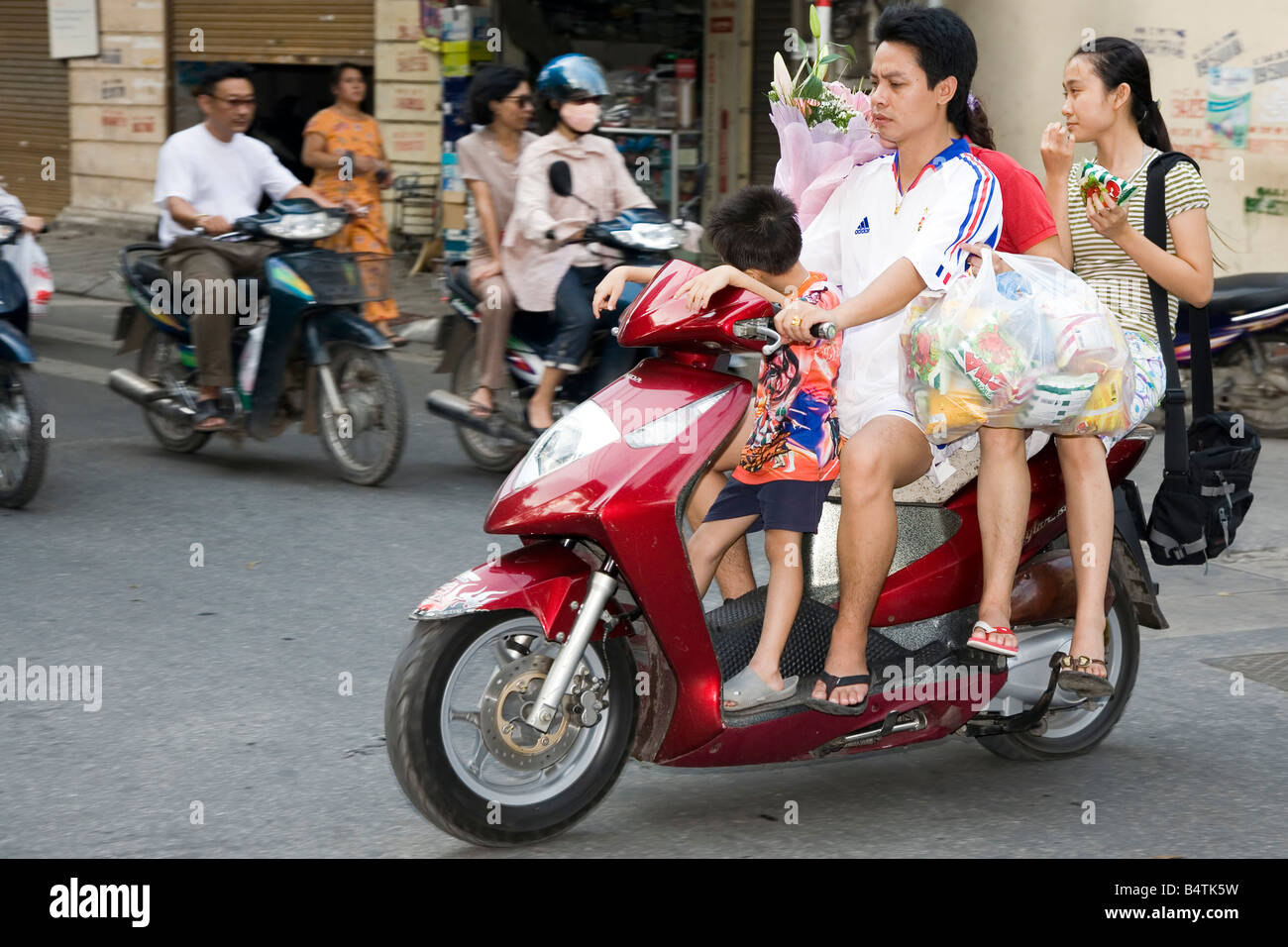 scooter four Hanoi Vietnam Stock Photo