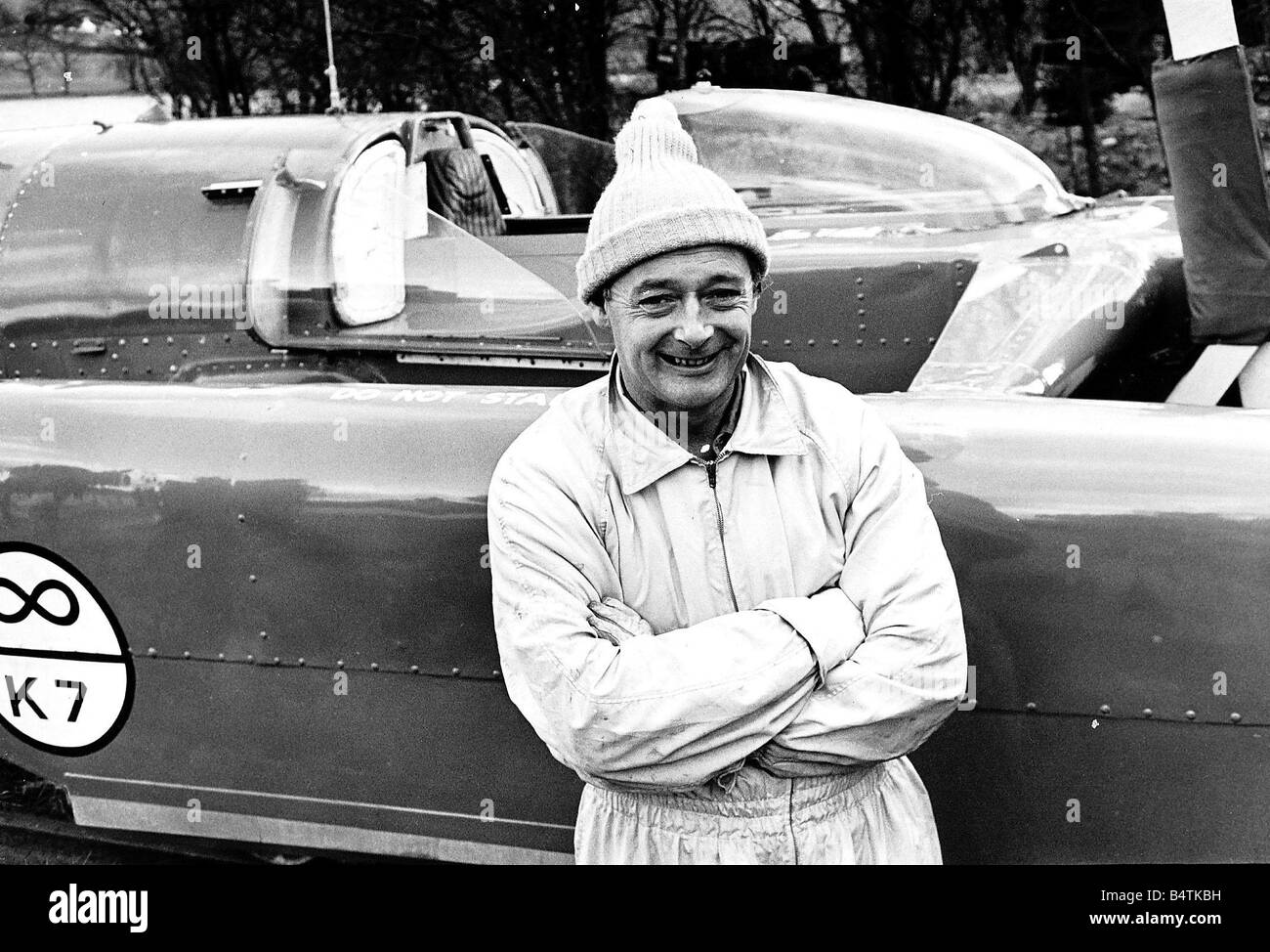 Donald Campbell leaning against Bluebird during a break in the test