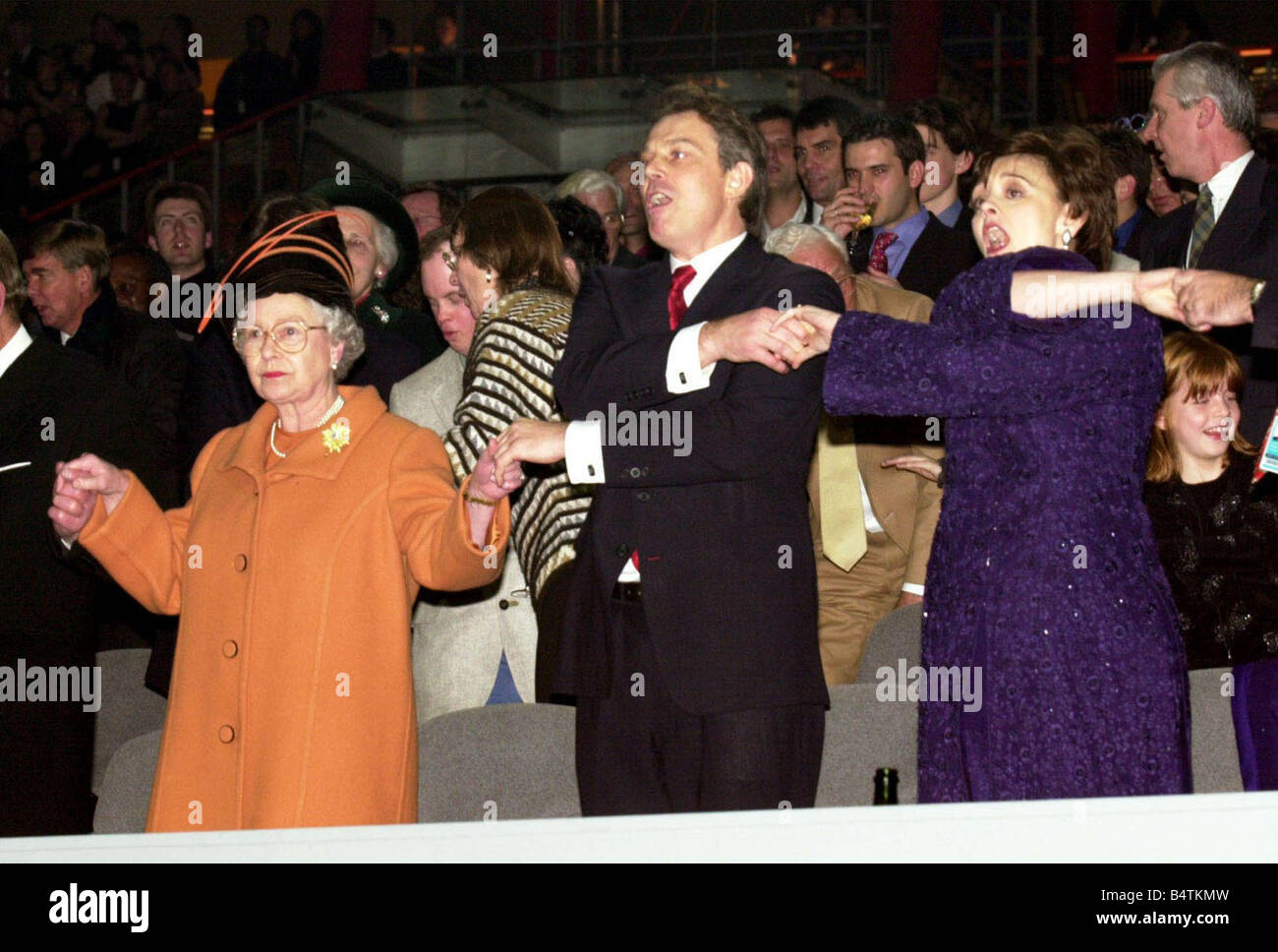 The Queen joins British Prime Minister Tony Blair and wife Cherie