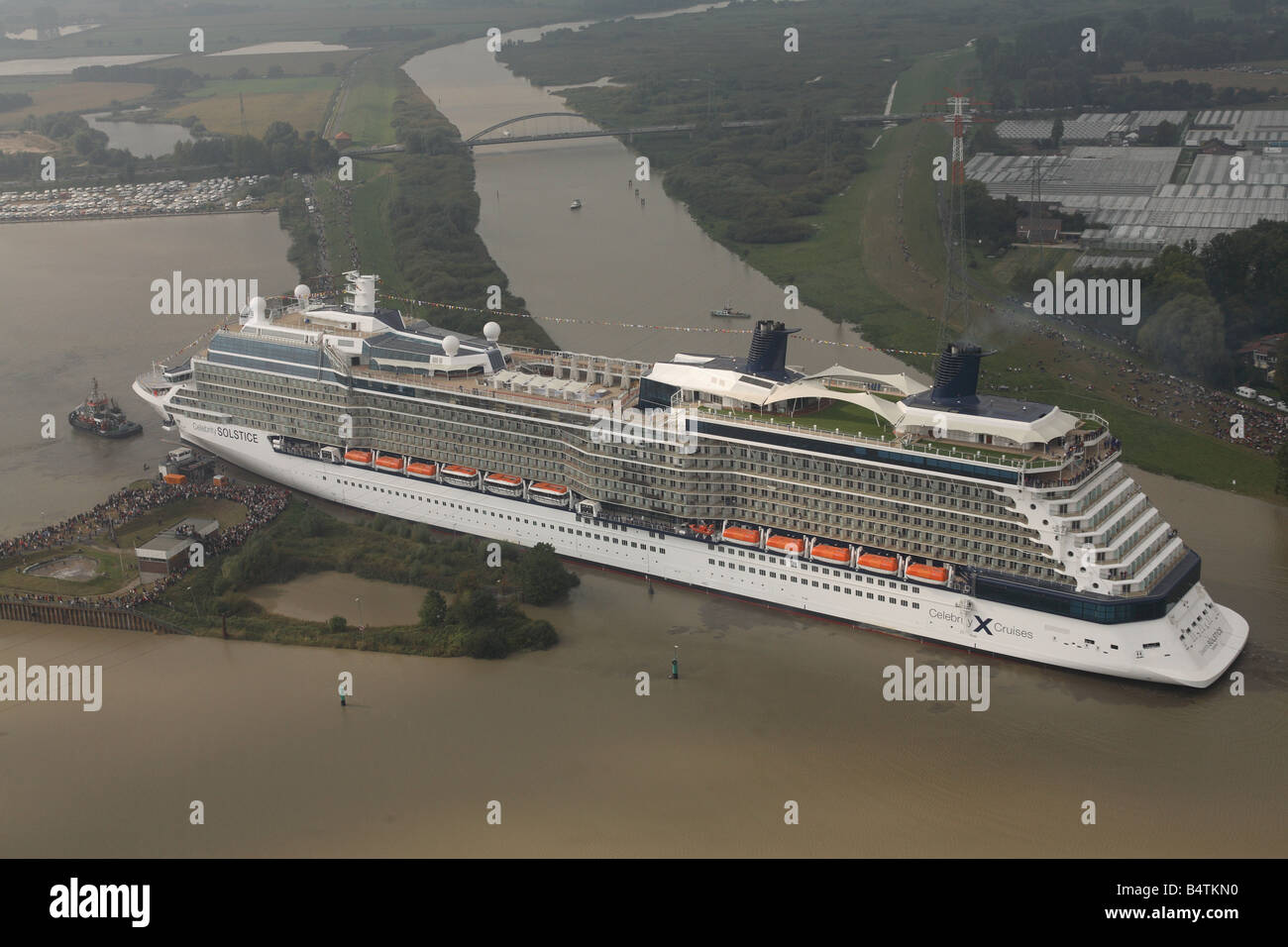 Cruise ship Celebrity Solstice is moved from the Meyer Werft shipyard where she was built out onto the river Emms. Stock Photo