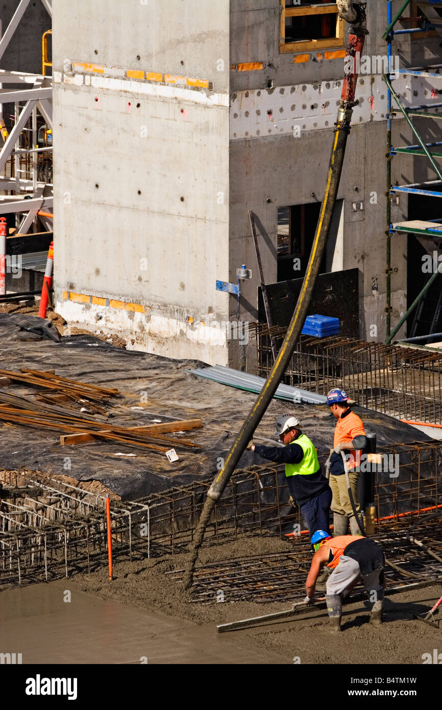 Construction / Construction Workers pour Cement on a Building Site