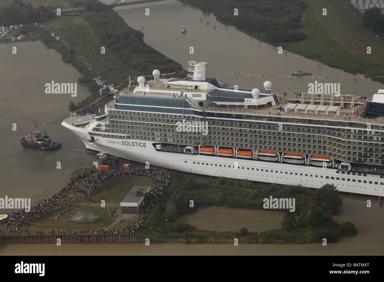 Cruise ship Celebrity Solstice is moved from the Meyer Werft shipyard where she was built out onto the river Emms. Stock Photo