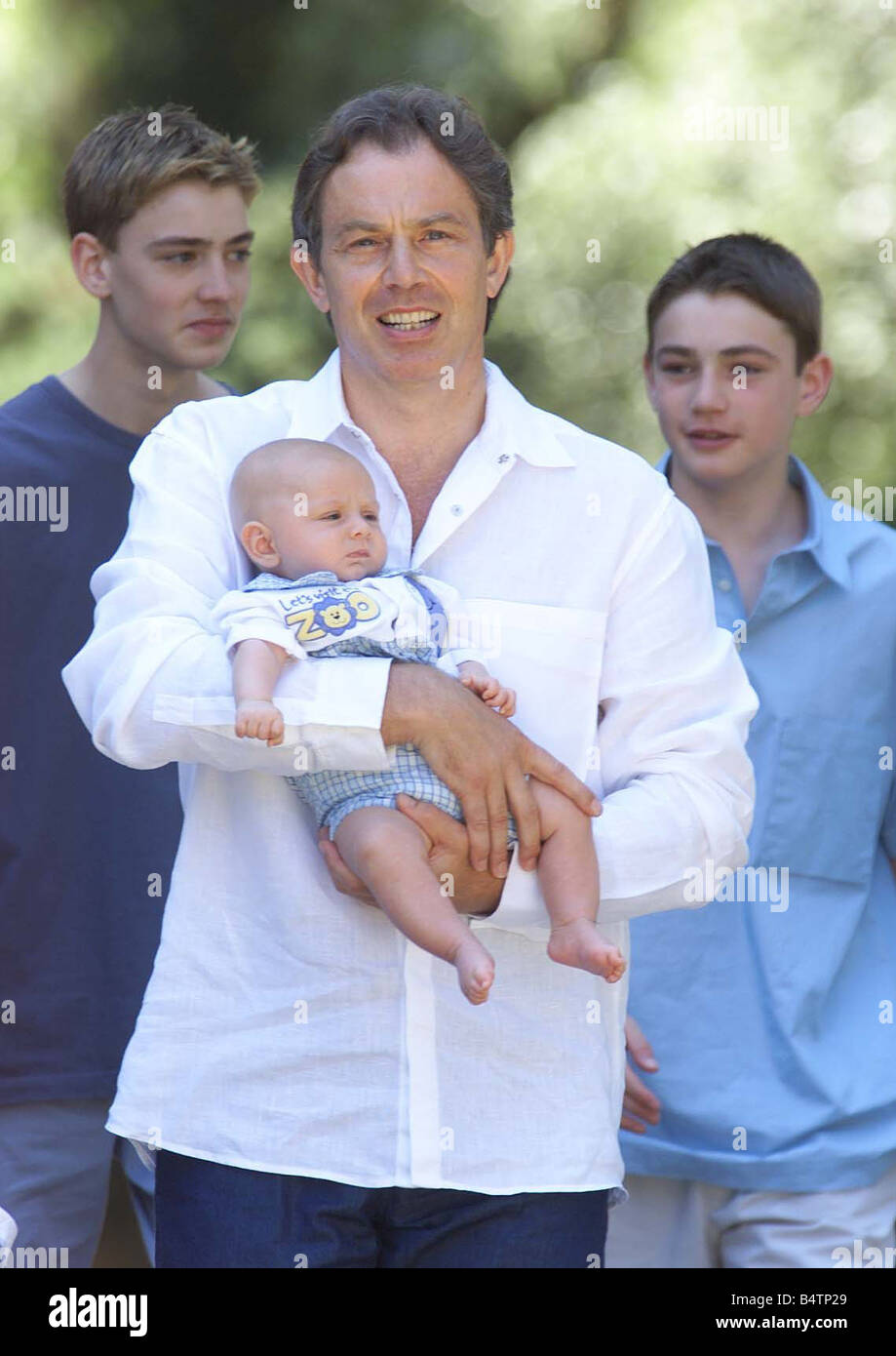 Britain s Prime Minister Tony Blair with baby Leo at Villa Cusona in Tuscany Italy All the Blairs including baby Leo faced the media at the hilltop villa where they are spending their summer break The traditional family photograph session at one point appeared to have been abandoned when Downing Street announced it would not be taking place this year The announcement followed protests from Downing Street that newspapers had refused a specific request by the Blairs to stay away from Leo s christening but officials denied they were acting in retaliation and said the decision to cancel the Stock Photo