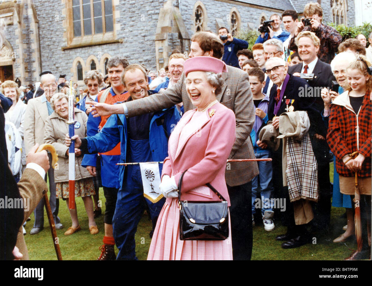 queen-elizabeth-ii-at-fort-william-august-1991-laughing-at-dj-jimmy-B4TP9M.jpg