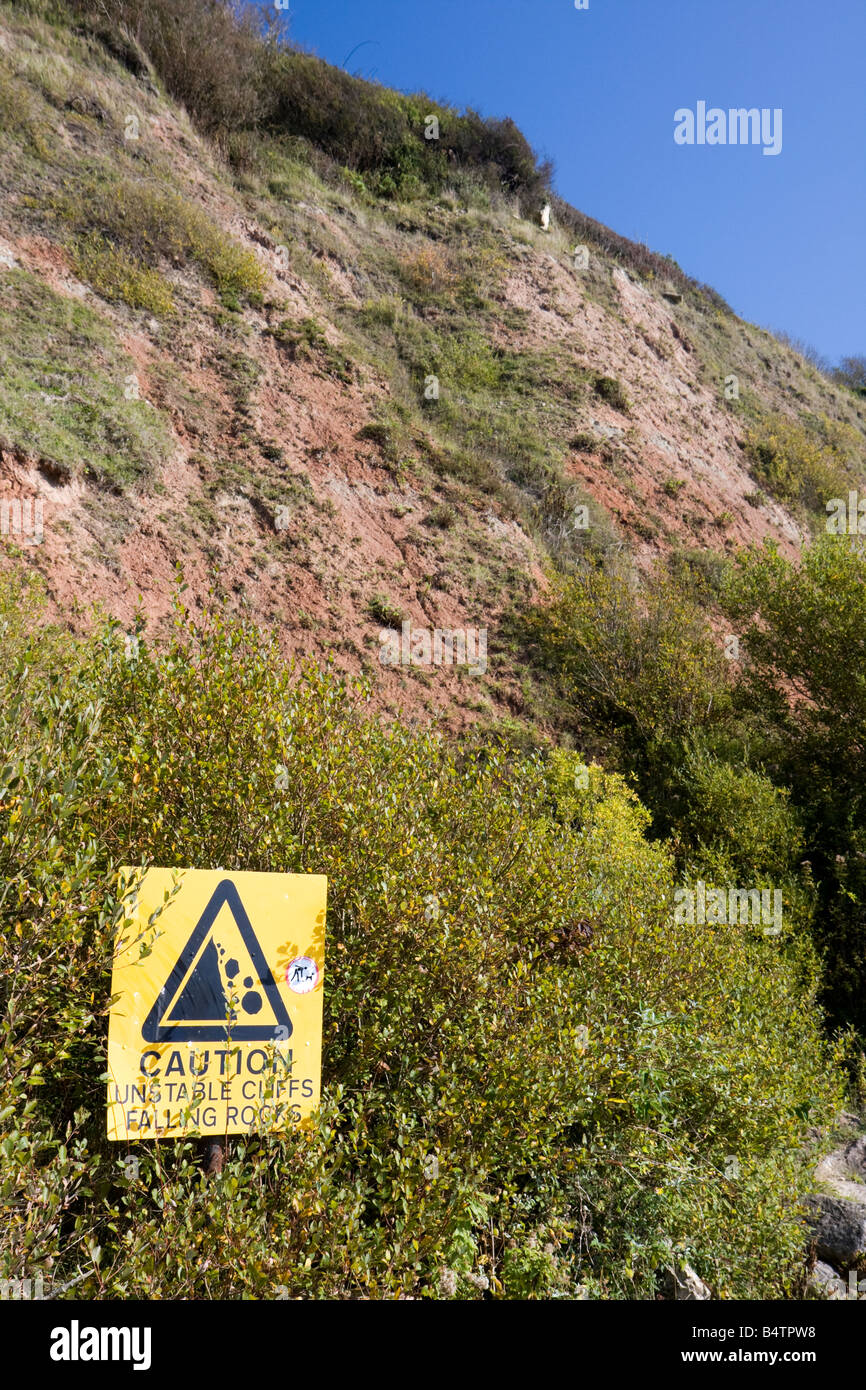 Warning sign on unstable cliffs, Axmouth, Devon Stock Photo - Alamy