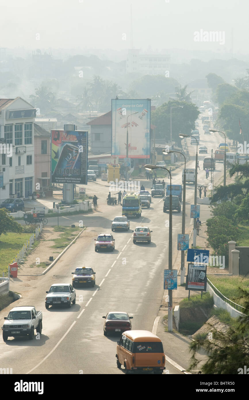 Cars driving along a road in Osu Accra Ghana Stock Photo