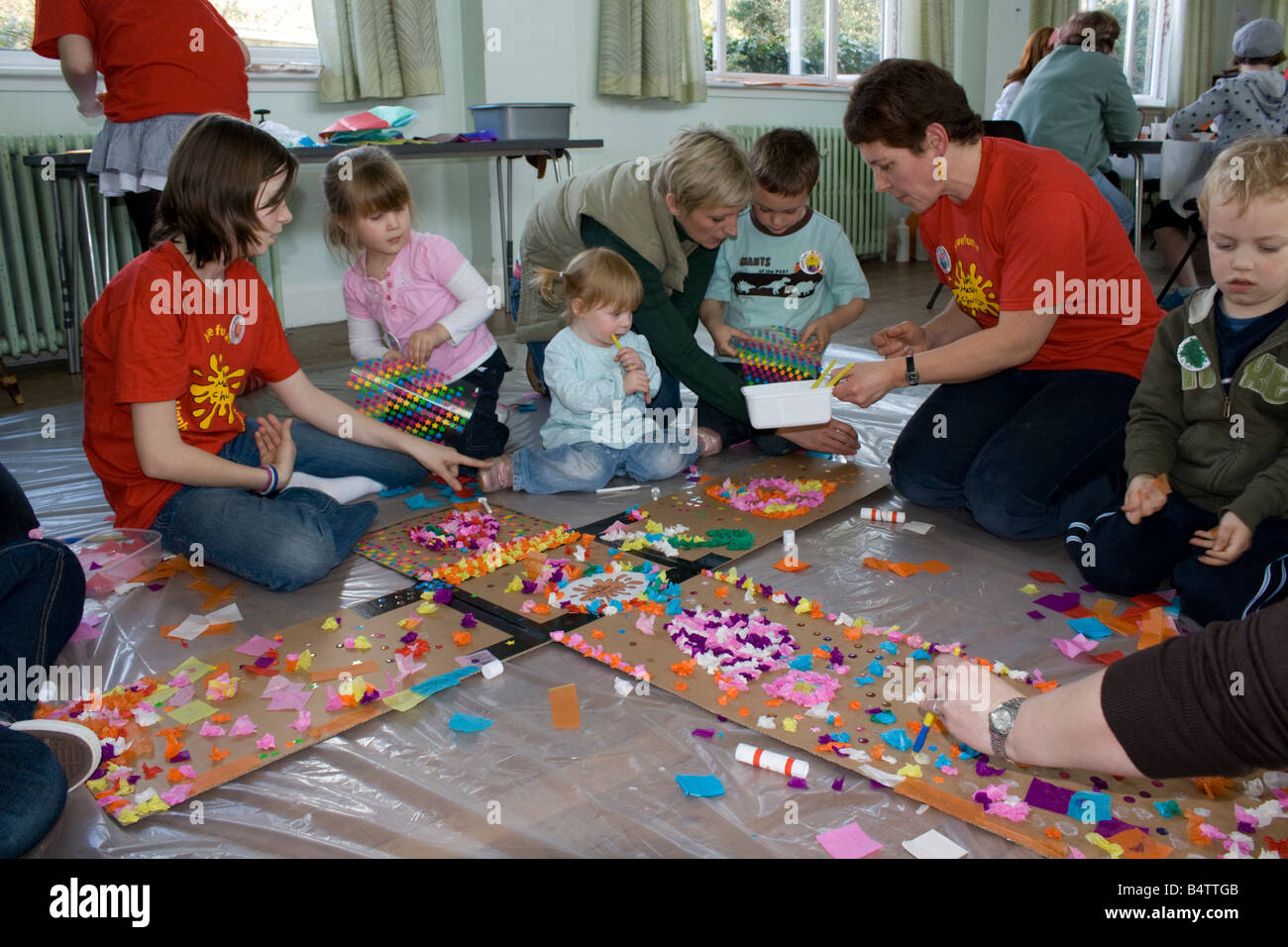 Church leaders doing craft work with toddlers Keynsham Bristol UK Stock Photo