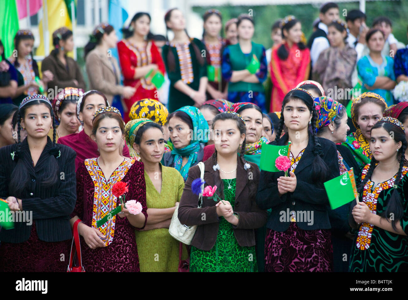 crowd of bored women watching dancers performing for delegates at an international conference on the outskirts of Ashgabat, Turkmenistan Stock Photo