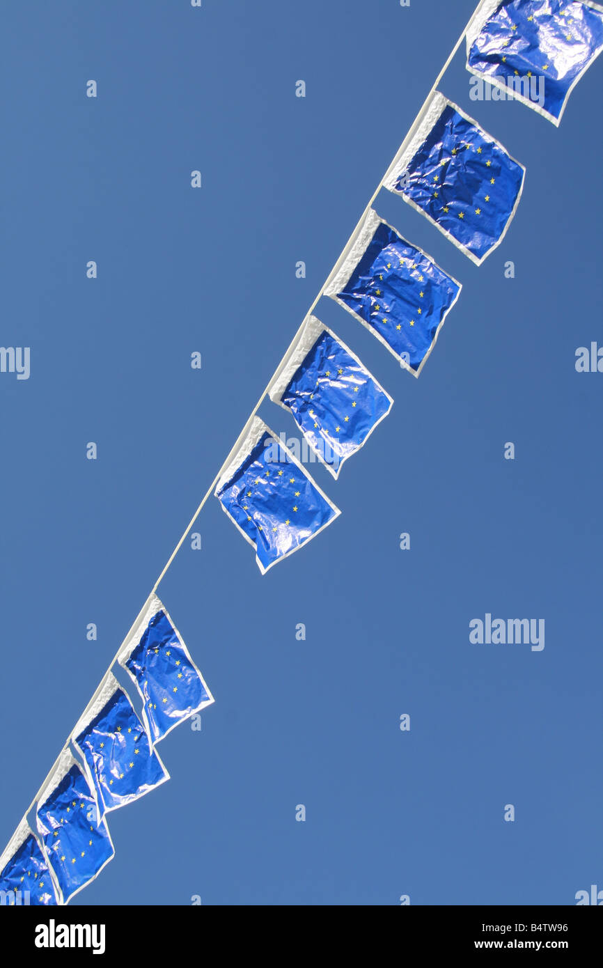 many european union flags flying in wind in sun Stock Photo - Alamy