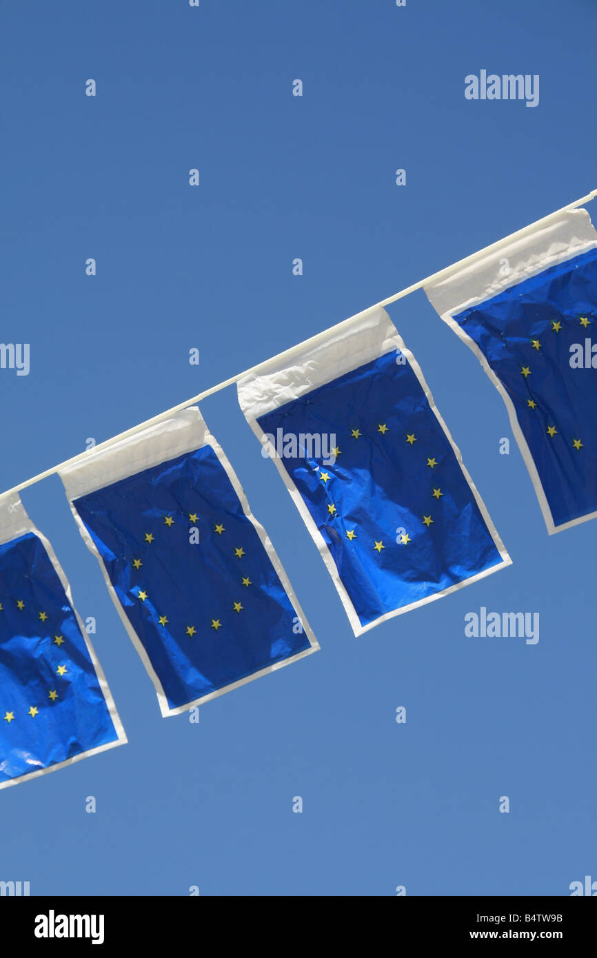 many european union flags flying in wind in sun Stock Photo - Alamy