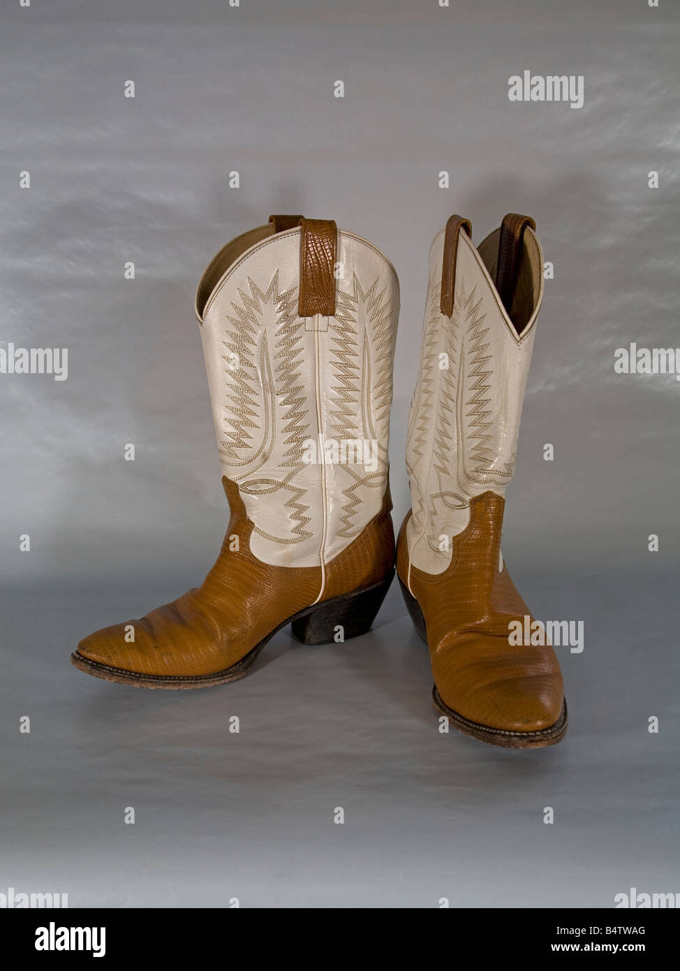 A pair of embroidered high heeled high topped western cowboy boots made in Mexico Stock Photo