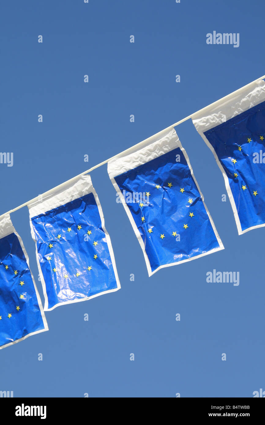 many european union flags flying in wind in sun Stock Photo - Alamy