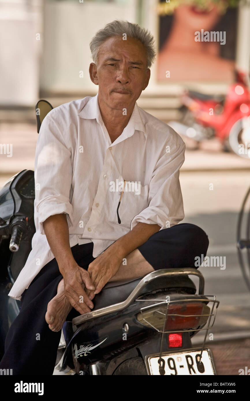 Vietnamese Motorcycle Rider Vietnamese motorcyle rider Hanoi North Vietnam Stock Photo - Alamy