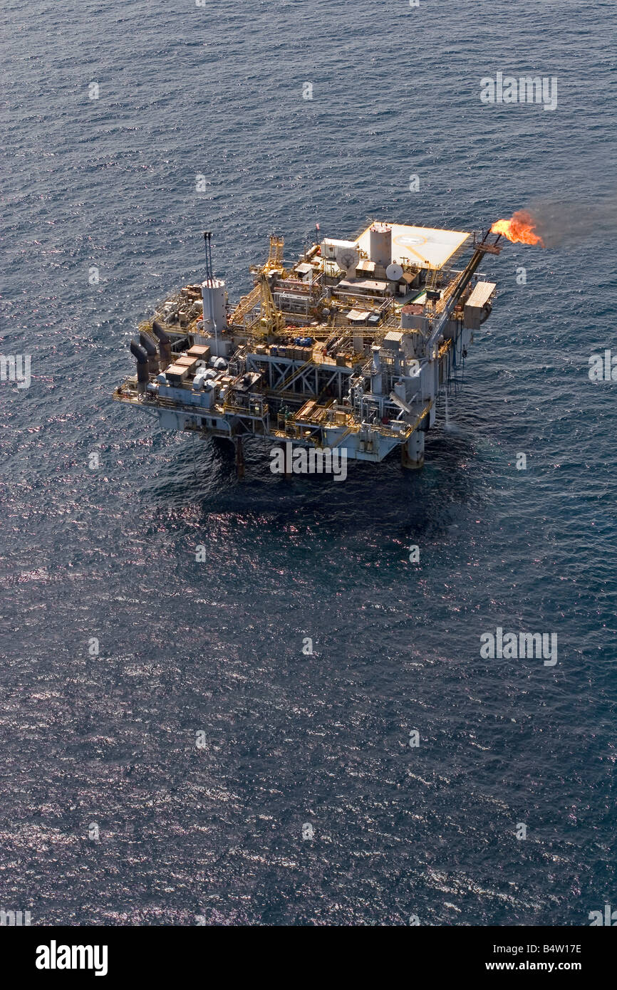 Aerial of offshore oil and gas production marine rig showing safety flare off coast of Gabon Stock Photo