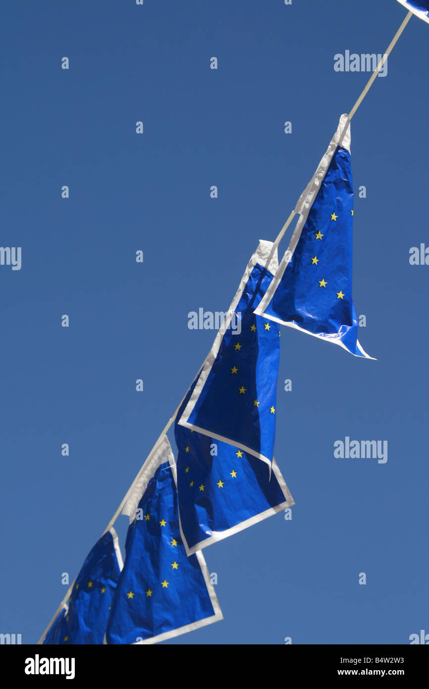many european union flags flying in wind in sun Stock Photo - Alamy