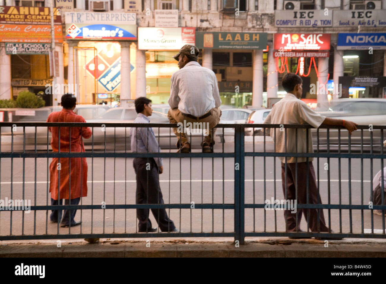 Young Indians hang around on the streets of New Delhi, India Stock Photo