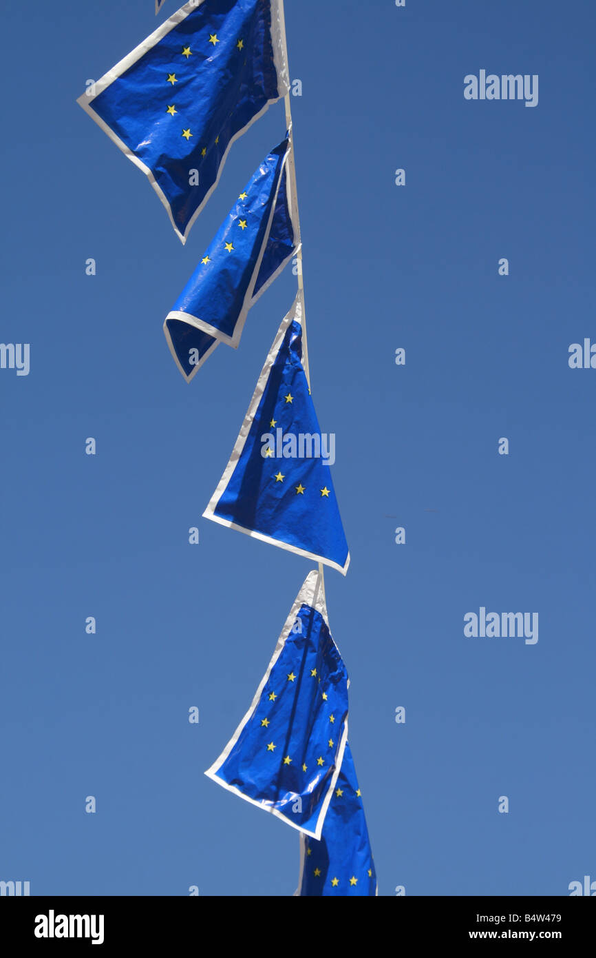 many european union flags flying in wind in sun Stock Photo - Alamy