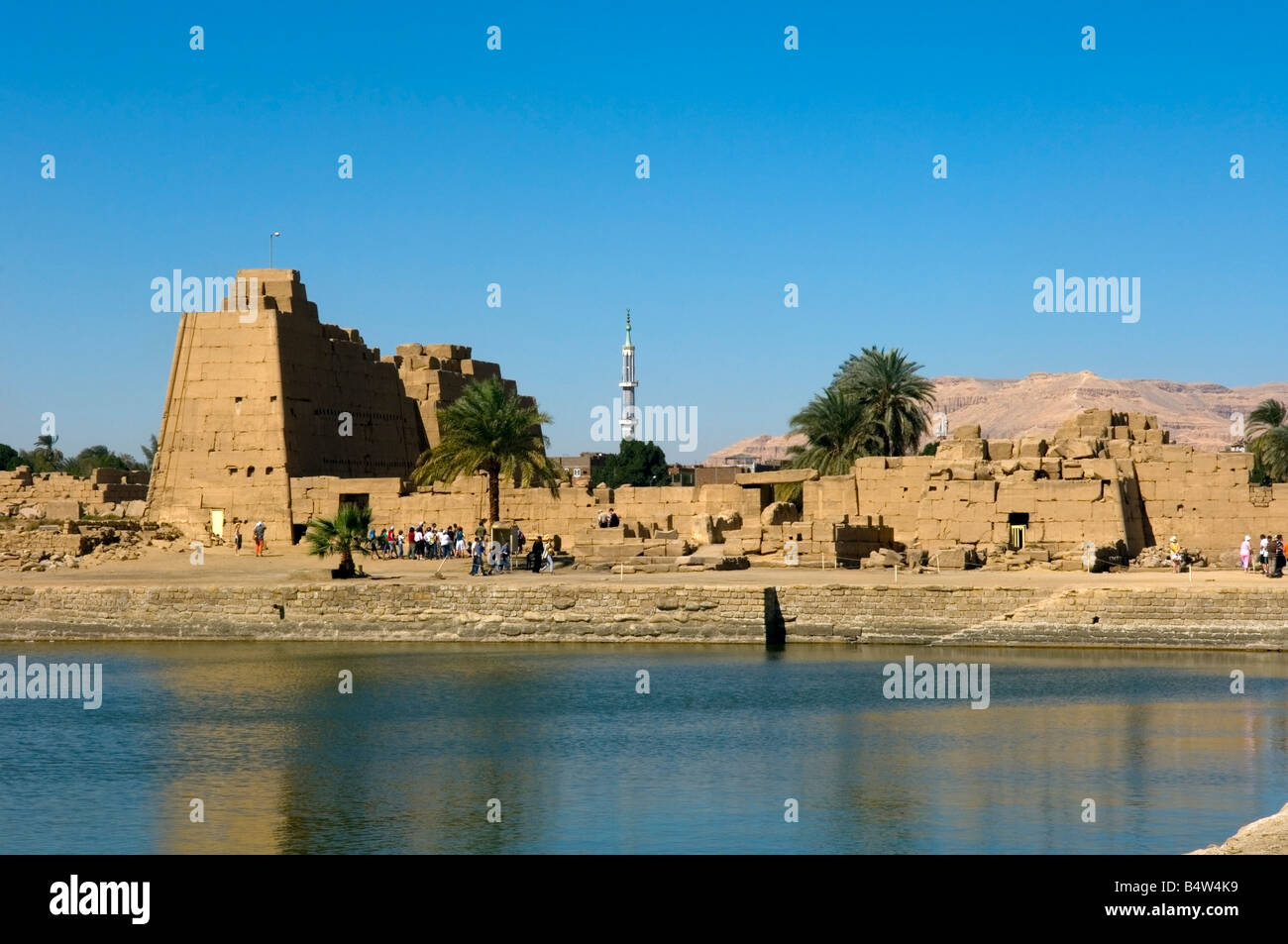 View across the Sacred Lake of the 8th pylon, Karnak Temple Complex, UNESCO World Heritage Site, Luxor, Egypt Stock Photo