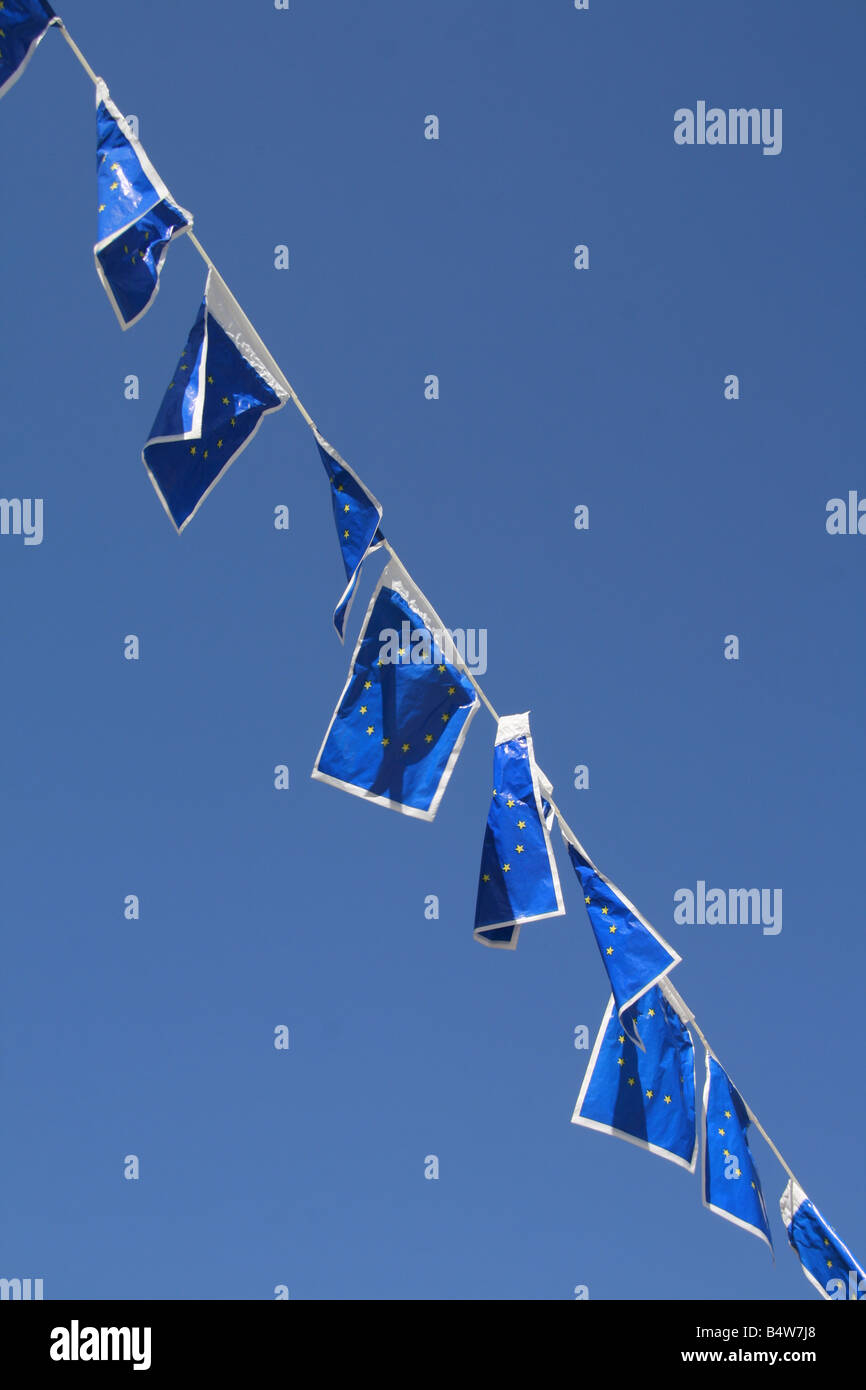 many european union flags flying in wind in sun Stock Photo - Alamy