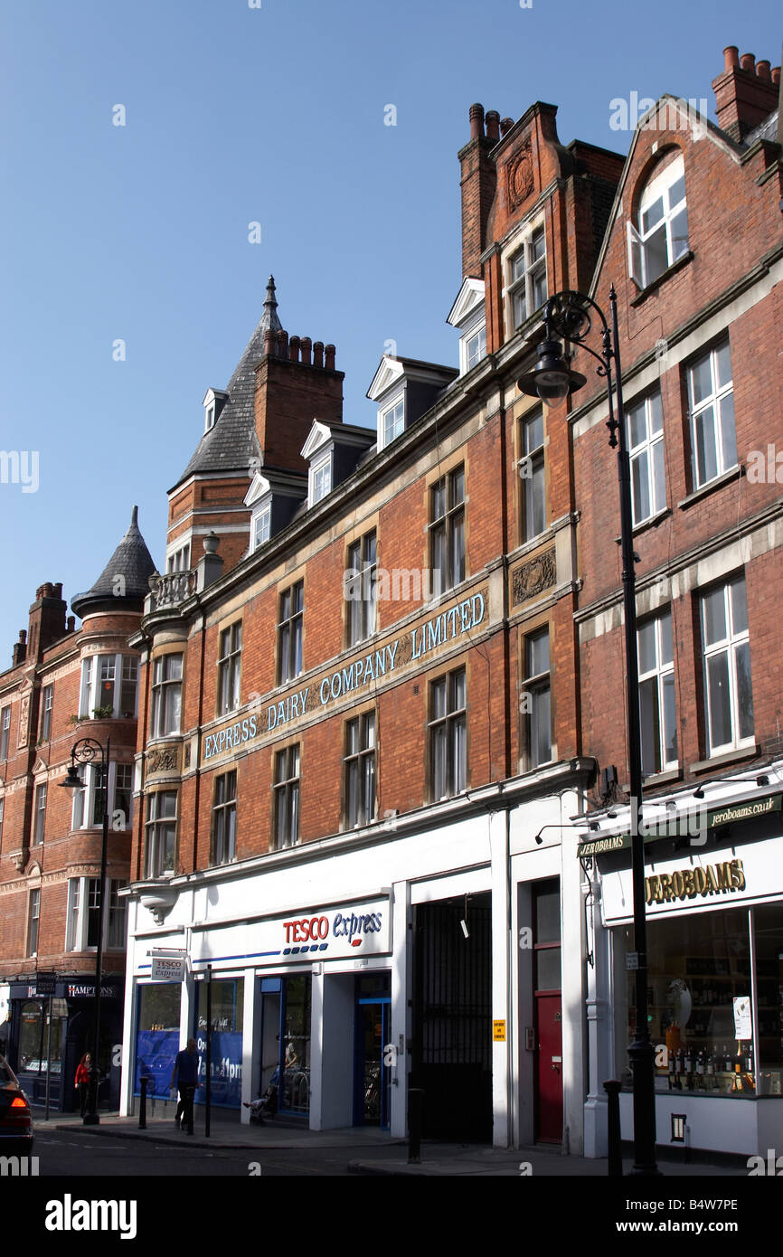 Express Dairy Company historic building Tesco express Shopping street in Finsbury Park N4 N19 London England Stock Photo