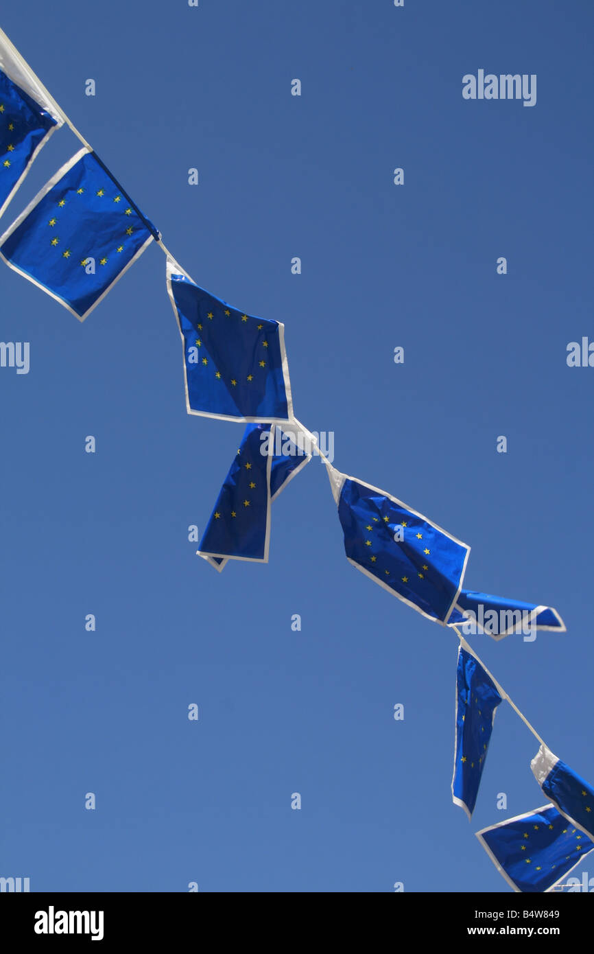 many european union flags flying in wind in sun Stock Photo - Alamy