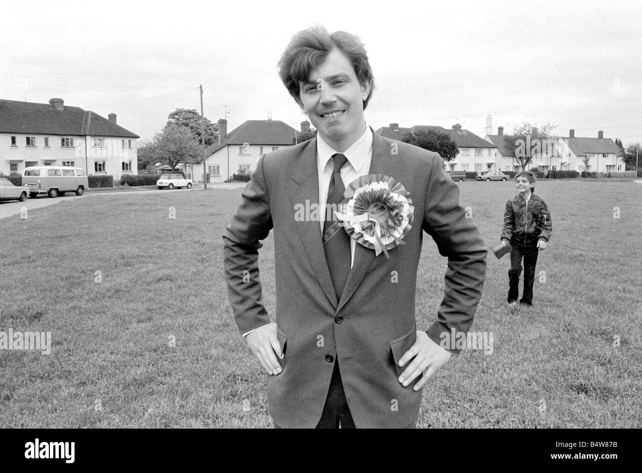 Tony Blair May 1982 of the Labour Party during canvassing for the Beaconsfield by election Wearing suit and labour rosette standing with hands on hips Mirrorpix com LAFRSSAPR05 0605 Stock Photo