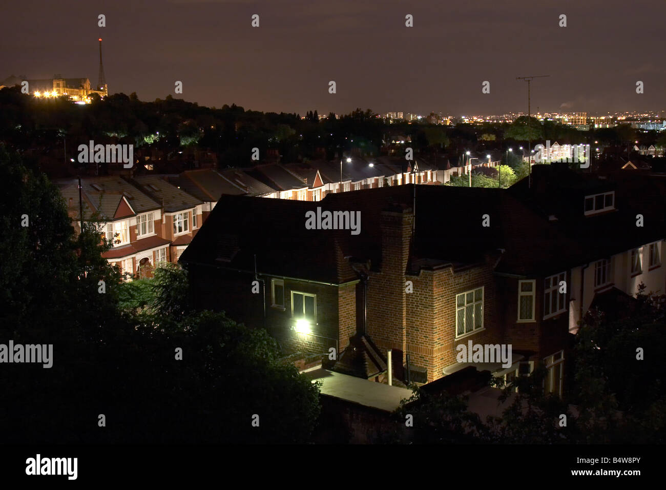 Light pollution from security light on house at dusk or night in Muswell Hill London N10 England Stock Photo