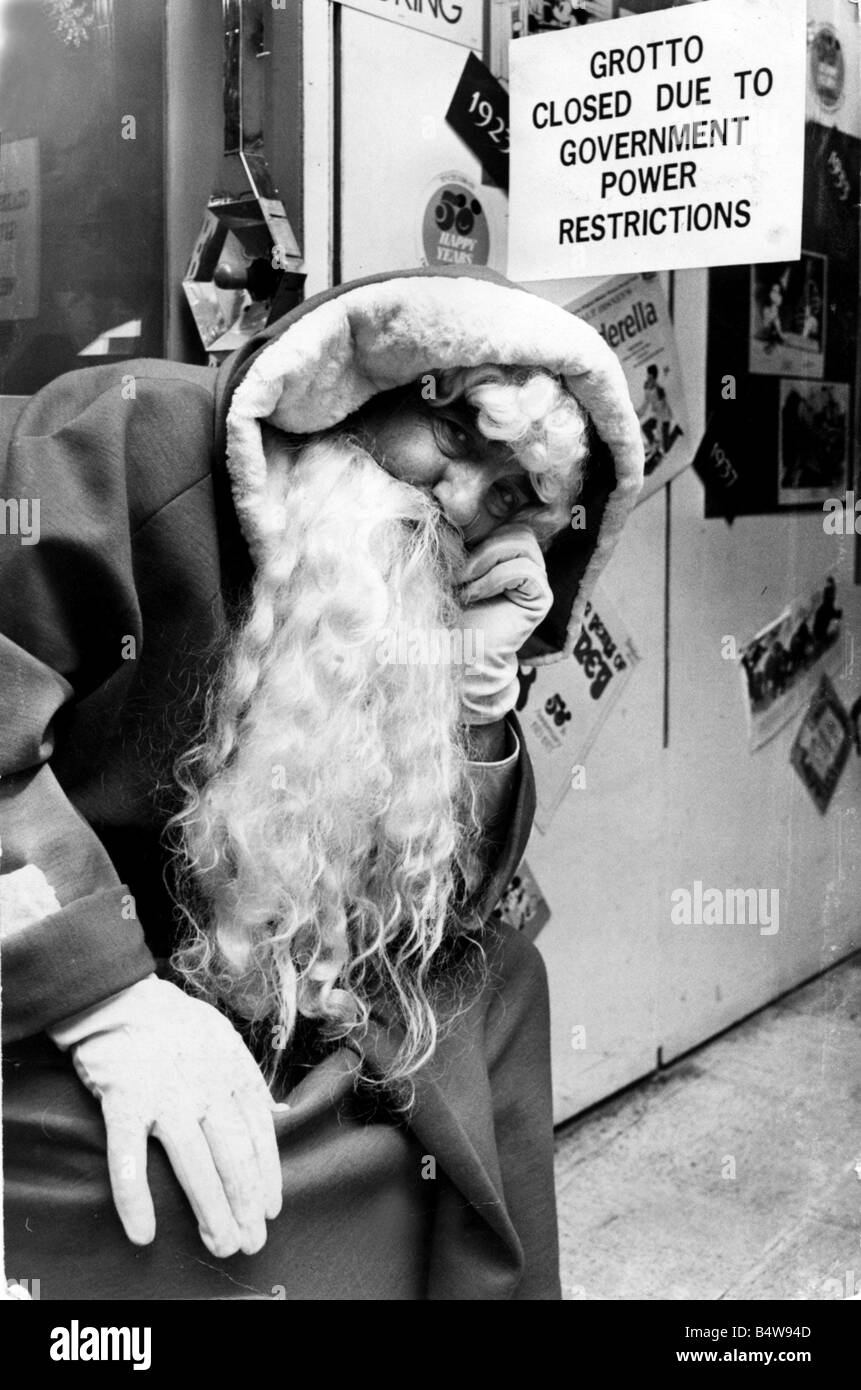 Christmas A saddened Father Christmas at David Morgan s store in Cardiff where the Government power restrictions prevented him showing children around the Toyland Grotto 13th Dec 1973 Stock Photo