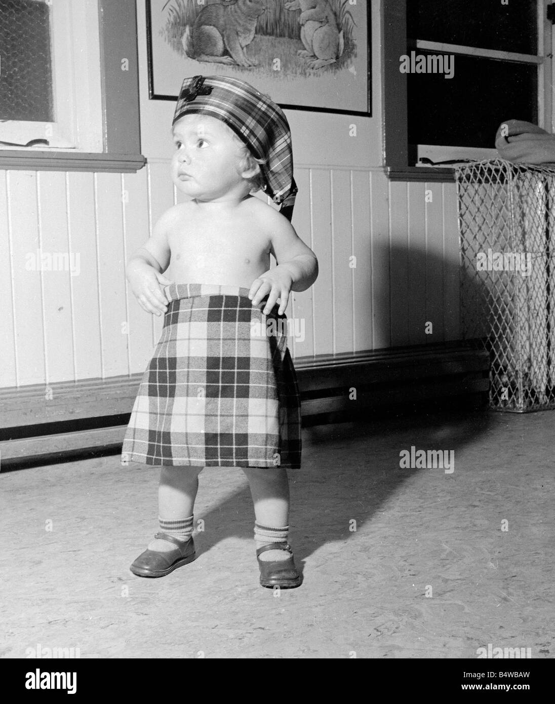 At Bridgeton, Day Nursery, near Glasgow they are getting prepared for their Christmas party. Each child who attends the party will have to do a turn.;Our Picture Shows: Frank Scottie Anderson seen here rehearsing his part as Harry Lauder.;December 1953;Neg No D7286; Stock Photo