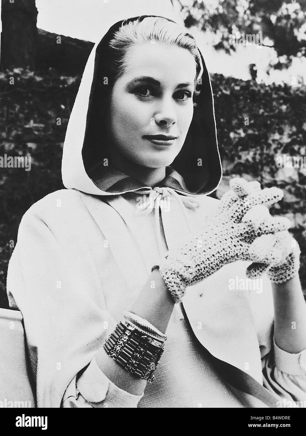 Grace Kelly actress stars in the film High Society wears hooded cape and gloves Stock Photo
