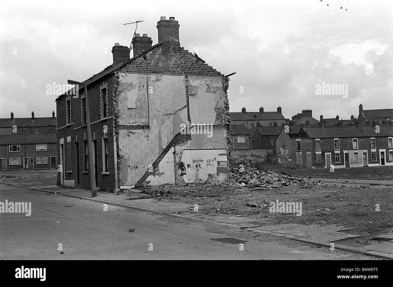 Residents Claim Of Housing Executive Conspiracy April 1980 An isolated block of houses juts out from the derelict Tiger Bay landscape Residents of Belfast s Duncairn district claim a Housing Executive conspiracy is killing their area Mirrorpix Stock Photo