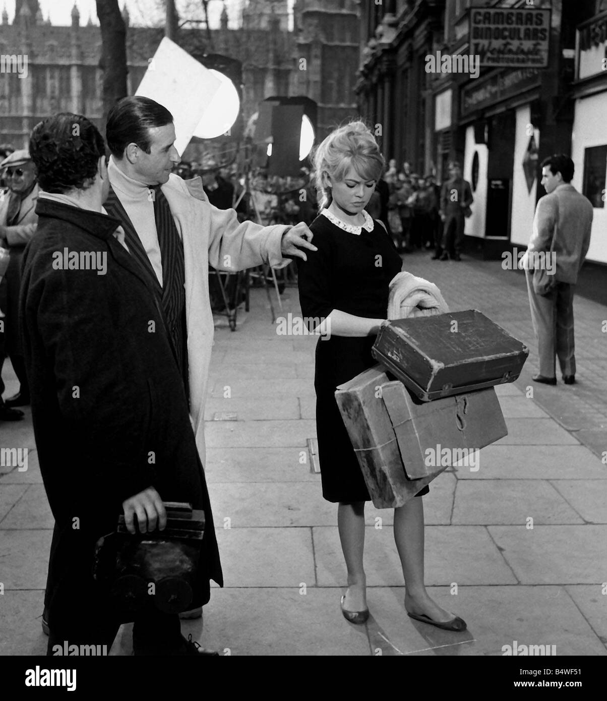 Brigitte Bardot French actress with director filming 1959 Babette Goes to War in London street Stock Photo