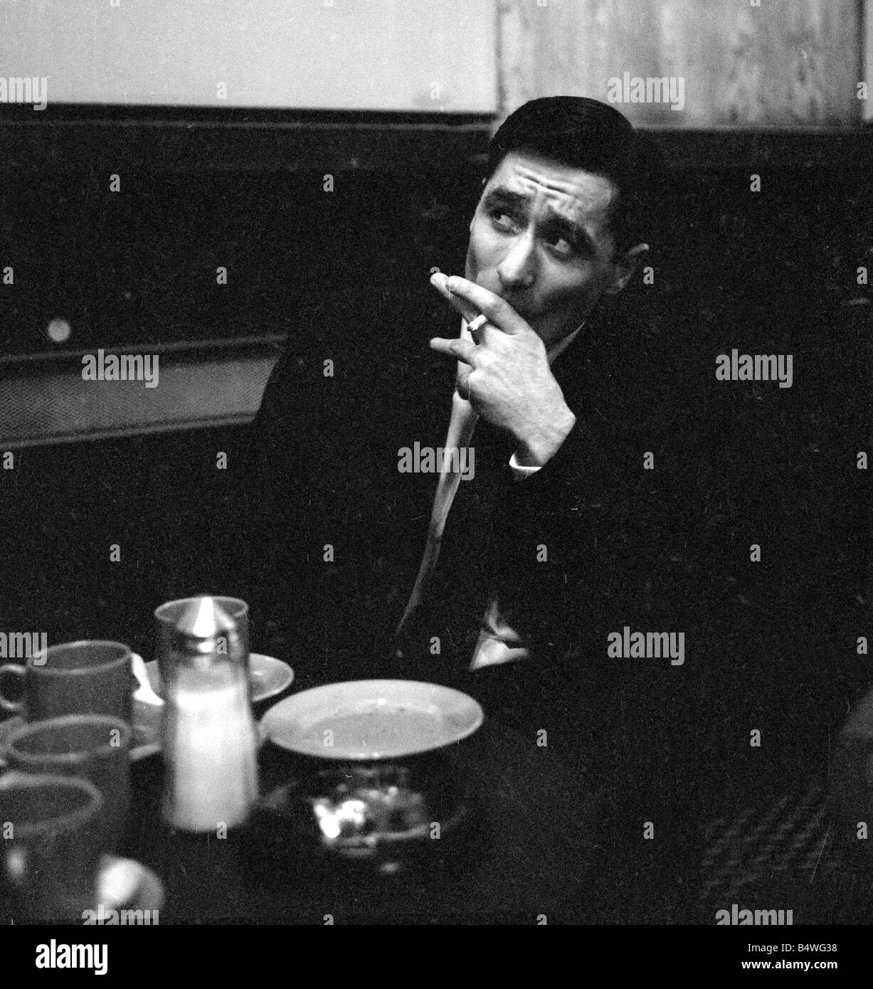 British gangster Dennis Stafford smoking a cigarette after his release from Armley Jail&#13;&#10;March 1964 Stock Photo