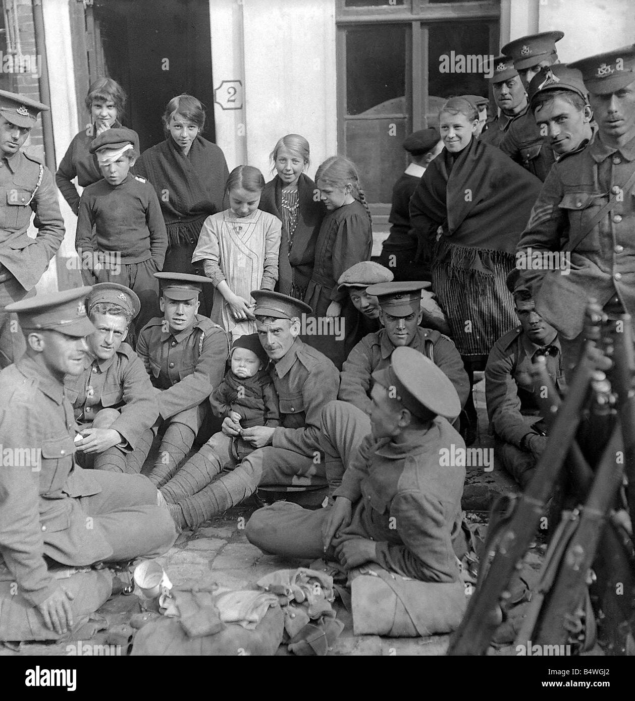 World War I English troops with Belgian baby Stock Photo