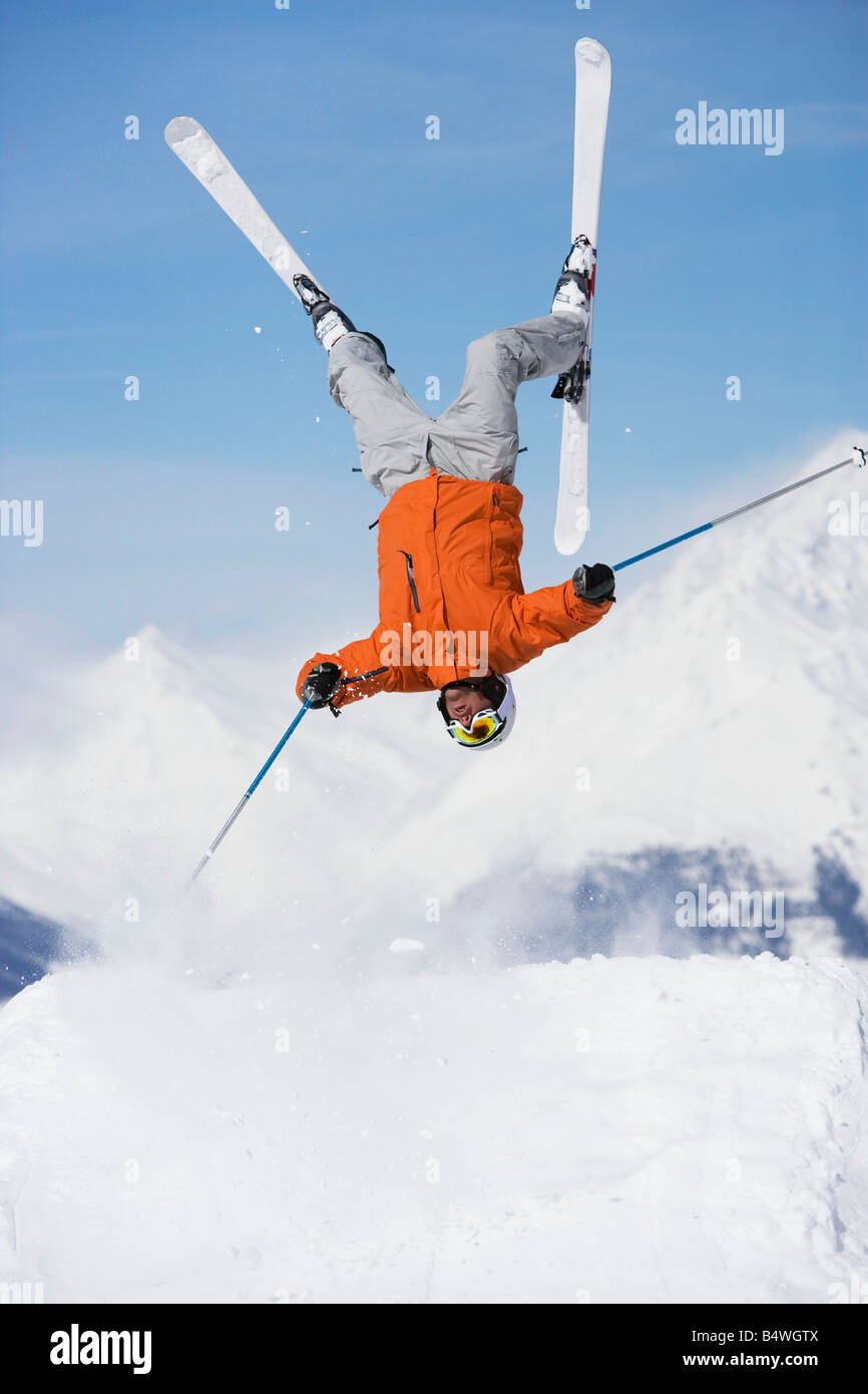 Skier jumping upside-down Stock Photo