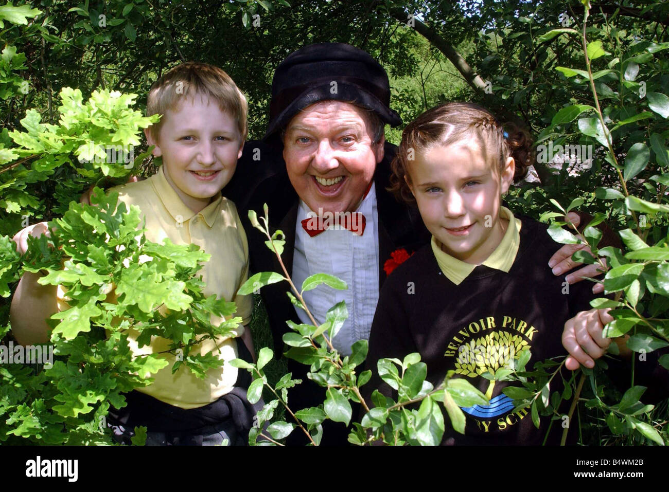 Jimmy Cricket At Belvoir Wood June 2003 Jimmy Cricket in the Woodland Trust s Belvoir Wood to inspire schoolchildren about woodland and nature with pupils from Belvoir PS Andrew Johnston and Rebecca Milburn Stock Photo