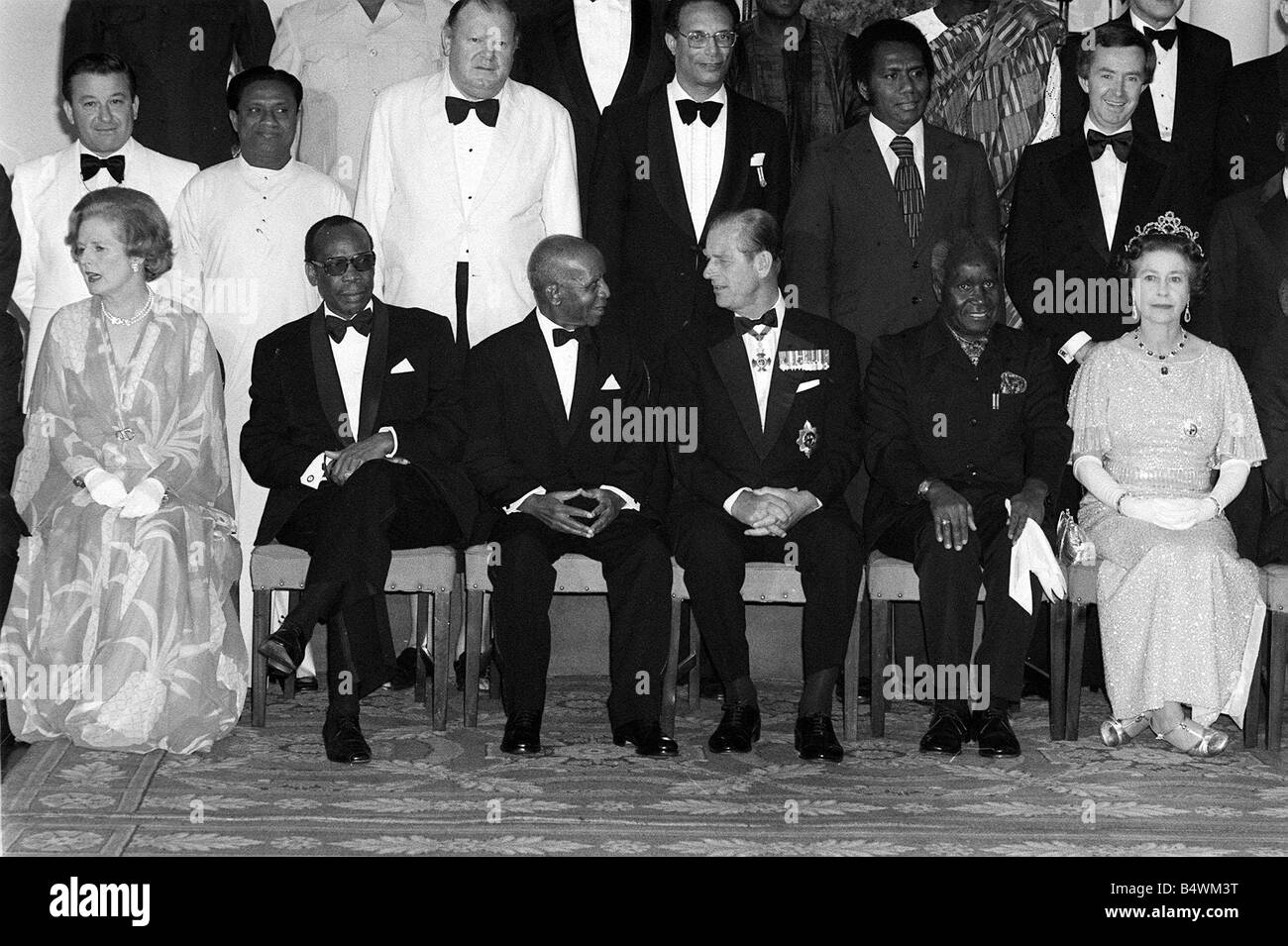 Prime Minister Margaret Thatcher seated with Queen Elizabeth IIand
