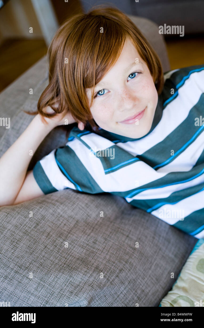 Portrait boy laying on a couch Stock Photo Alamy