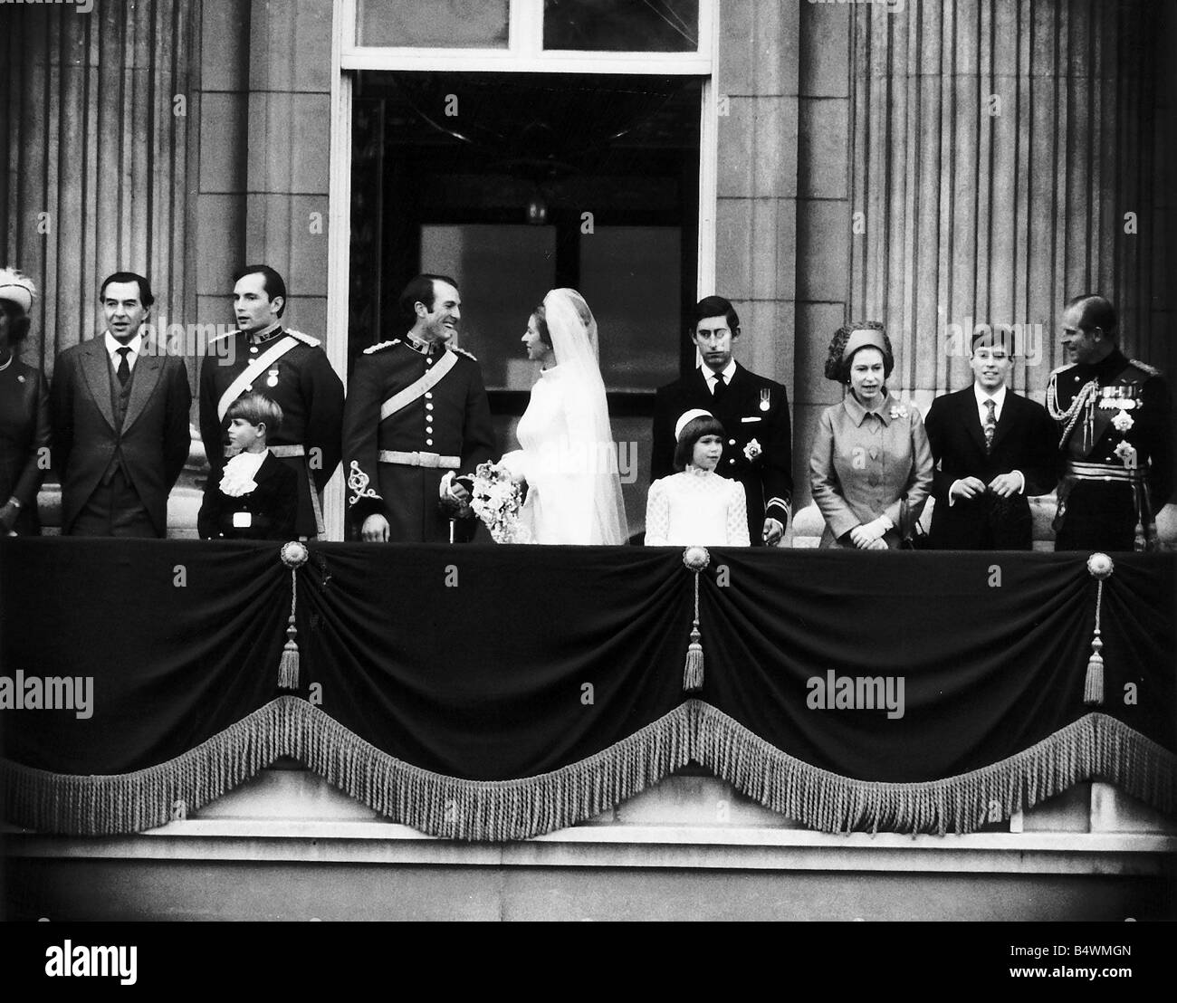 Princess Anne the daughter of Queen Elizabeth after her marriage to Captain Mark Phillips of the Queens Dragoon Guards at Westminster Abbey The couple are standing on the balcony of Buckingham Palace after the wedding breakfast with Major and Mrs Peter Phillips groomsman Captain Eric Grounds pageboy Prince Edward Mark Phillips and Anne Prince Charles bridesmaid Lady Sarah Armstrong Jones Queen Elizabeth Prince Andrew and Prince Philip November 1973 Stock Photo