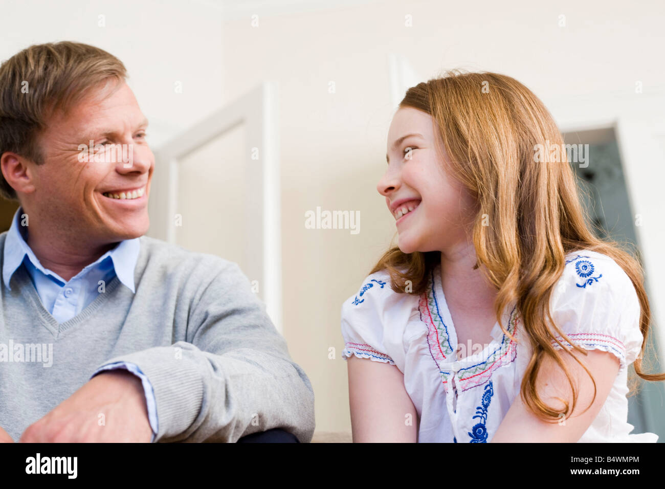 Father and daughter smiling Stock Photo