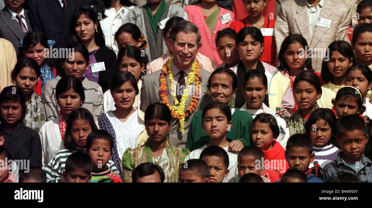 Prince Charles poses with young Nepalese children February 1998 Following his visit to the womens refuge earlier The shelter rescues young women from poor Nepali families who have been tricked into prostitution thinking they were being taken to India to work in factories Stock Photo