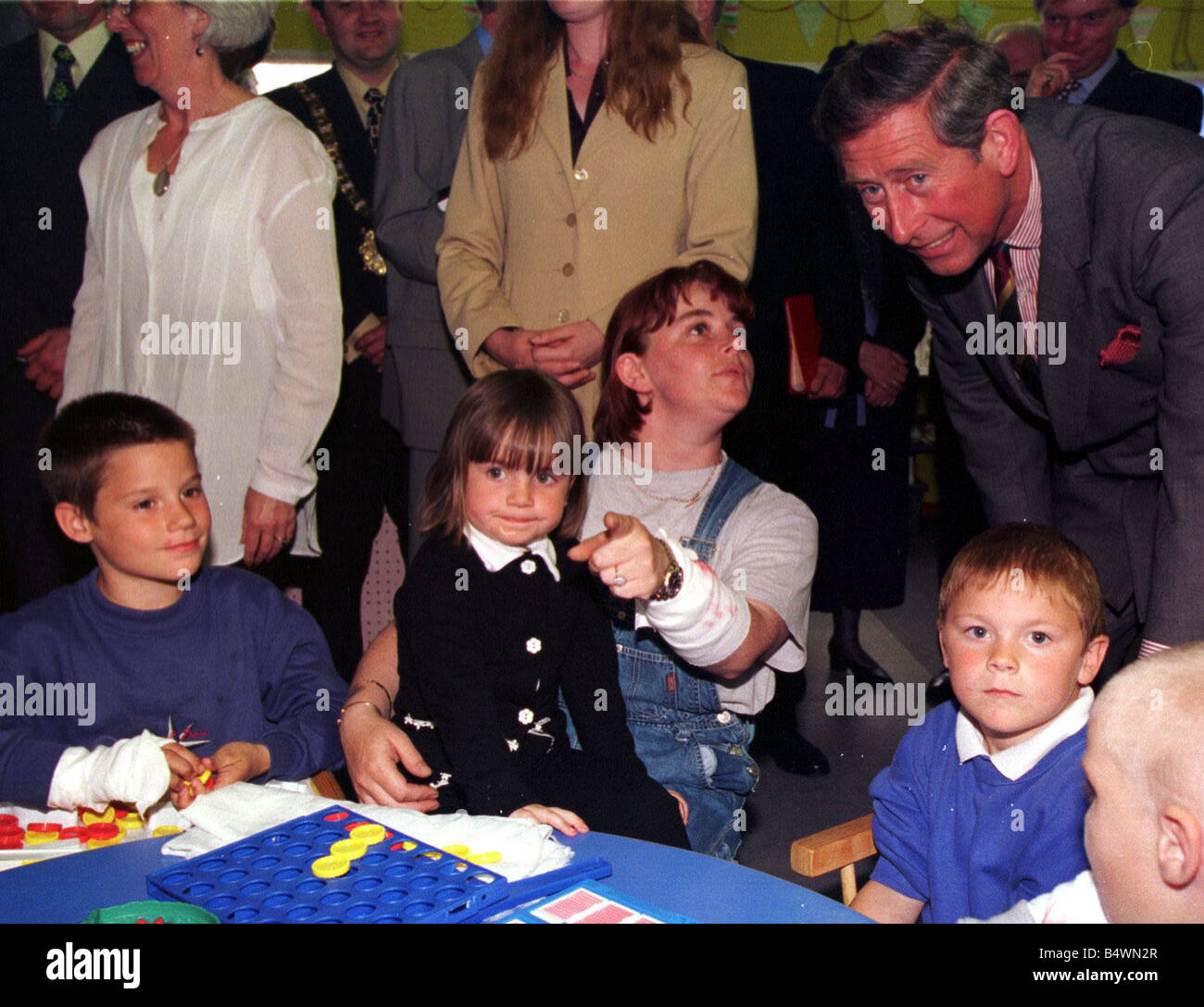 Prince Charles Visits Northern Ireland This young man finds the camera rather more interesting than Prince Charles during the VIP s visit to the Carew Family Centre in east Belfast June 1998 Stock Photo