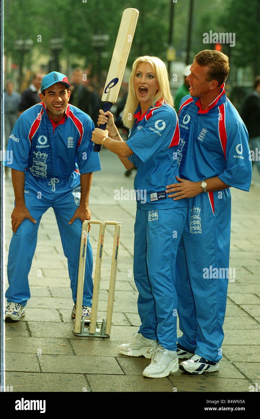Caprice Model with England cricket players Adam Hollyoak and Alec Stewart sporting the New England Strip Stock Photo