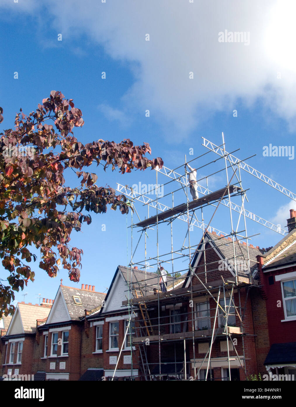 Scaffold being erected for loft conversion work Stock Photo