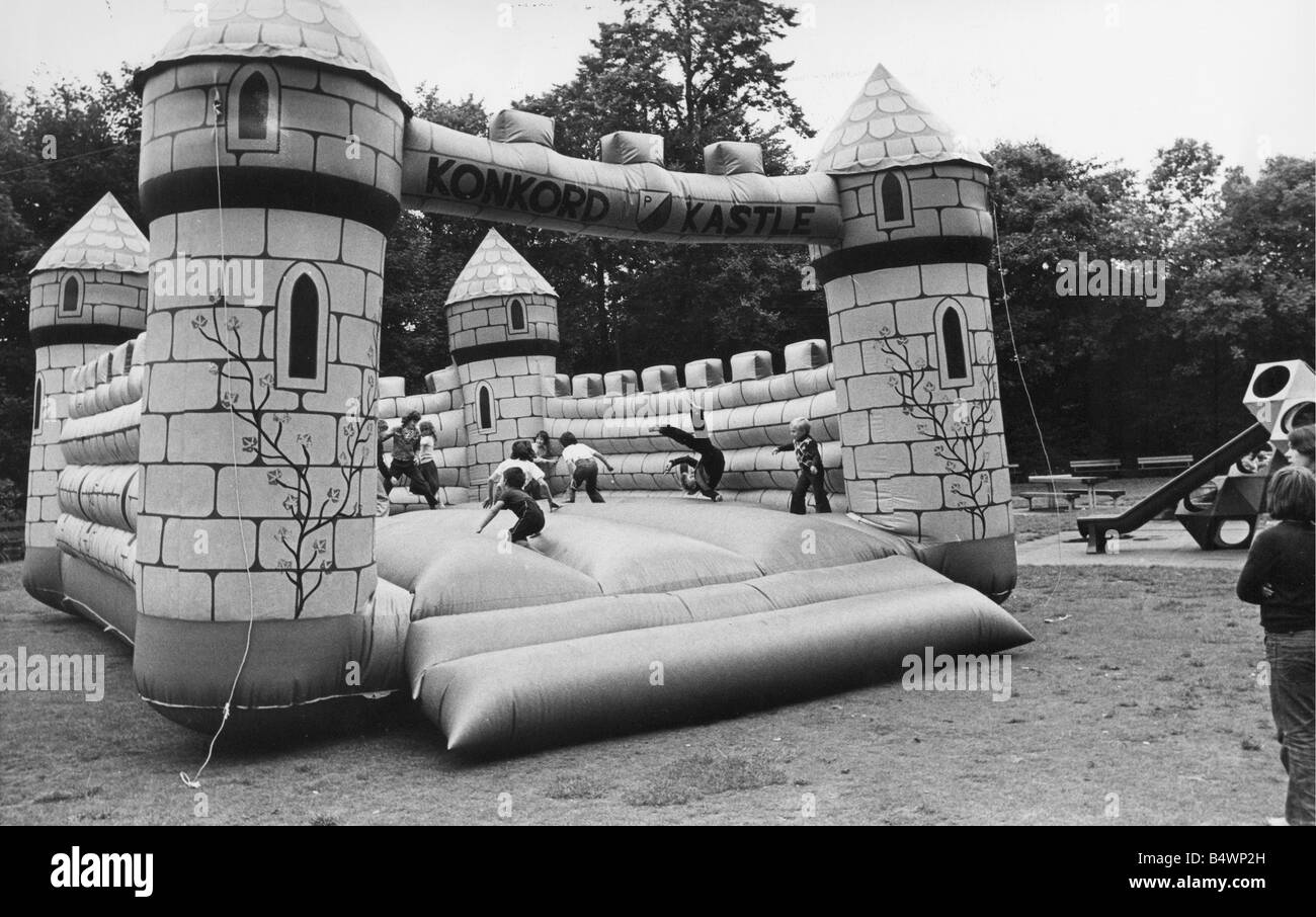 Children enjoy a bouncy castle Stock Photo